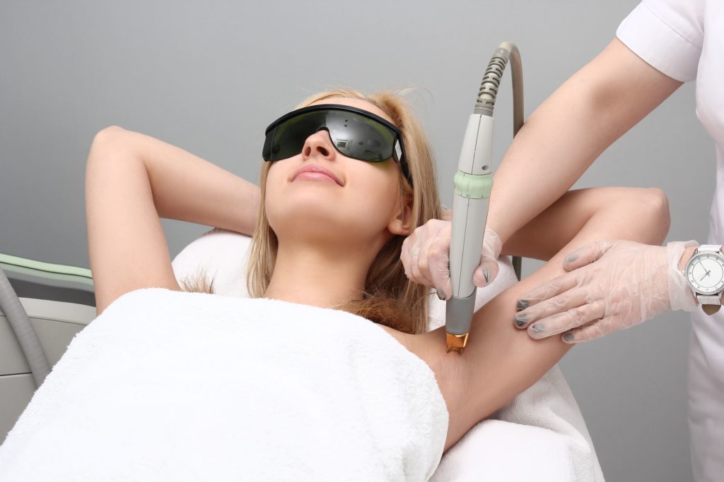 Young Female Getting hair removal Treatment | The Skin Refinery in Fayetteville, TN